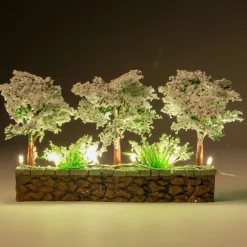 Intratuin kerstdorpminiatuur muur met besneeuwde bomen 20 x 7,5 x 11 cm