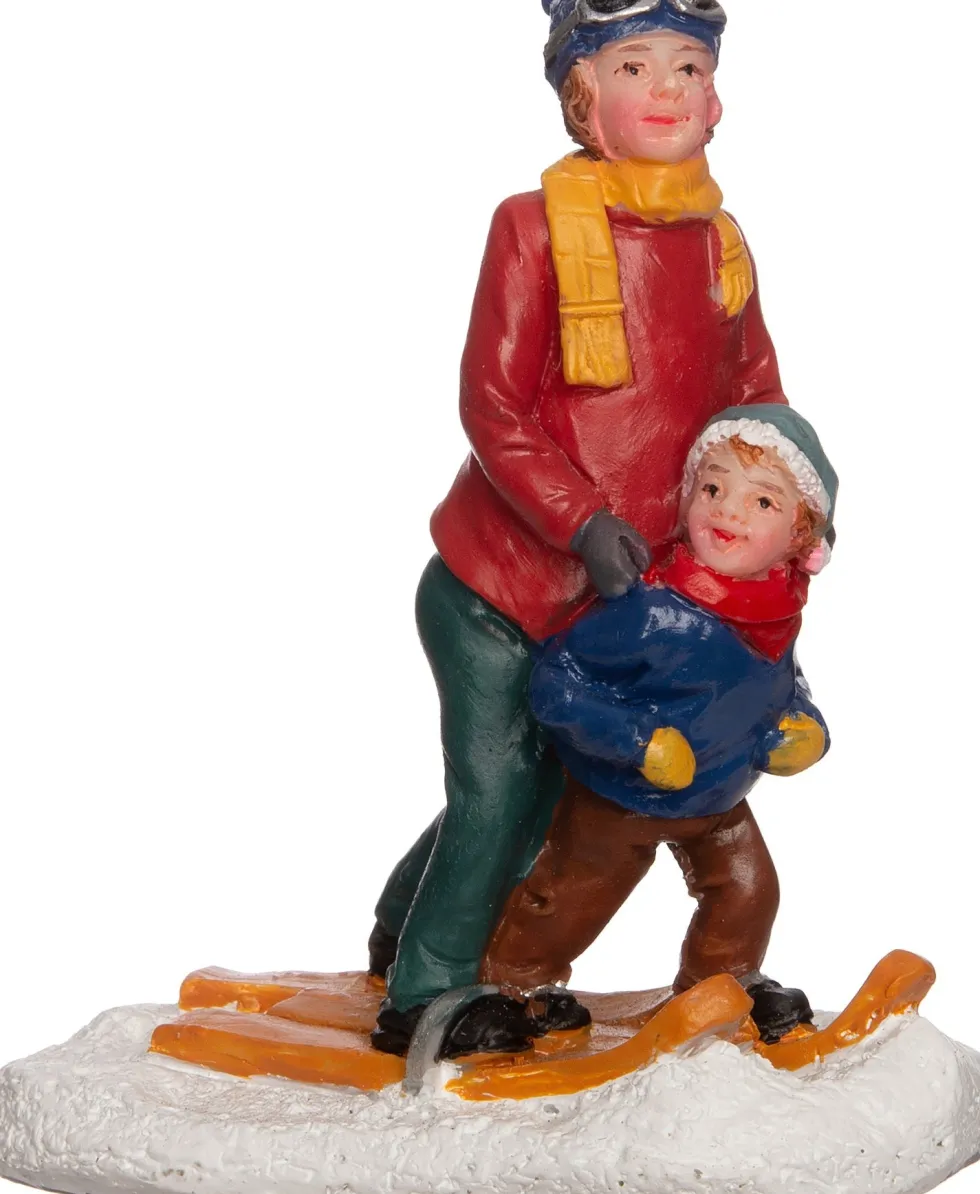 Intratuin kerstdorpminiatuur vrouw met kind op skies 6 x 3 x 7 cm