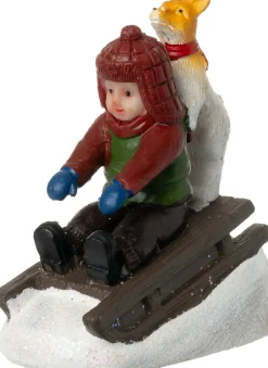 Intratuin kerstdorpminiatuur kind en hond op slee 5,5 x 3 x 6,5 cm